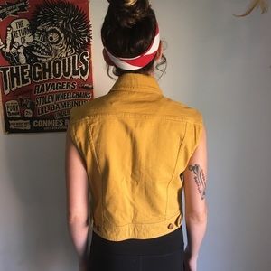 Women’s yellow denim vest.